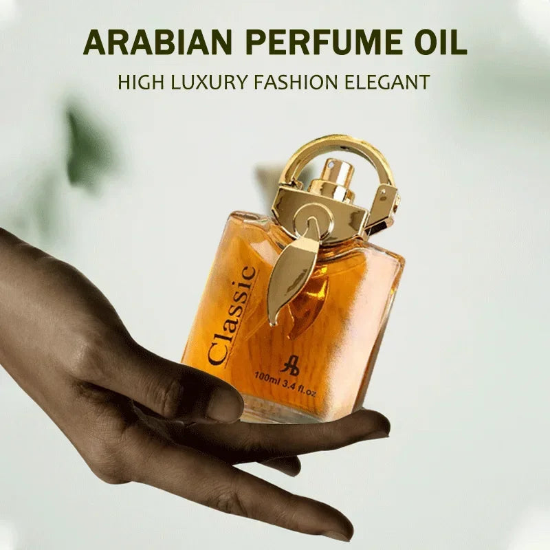 Hand holding rectangular amber perfume bottle with ornate gold cap and "Classic" label.