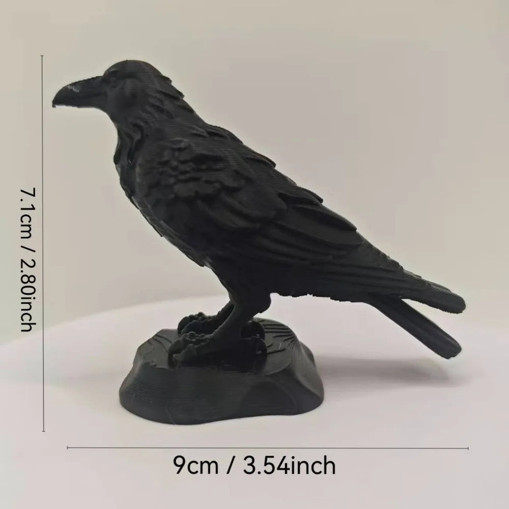 Matte black raven figurine perched on a rocky base, 7.1cm tall and 9cm wide. Detailed 3D-printed gothic style decor.