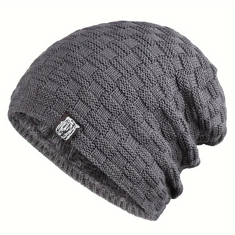 Charcoal grey men’s beanie with a textured, cable-knit pattern and a thick, soft faux-fur lining.