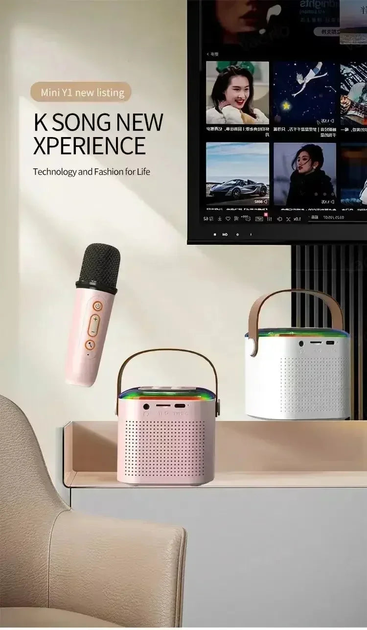 Pink and white portable karaoke speakers with carry handles, RGB lighting, and a matching handheld microphone.