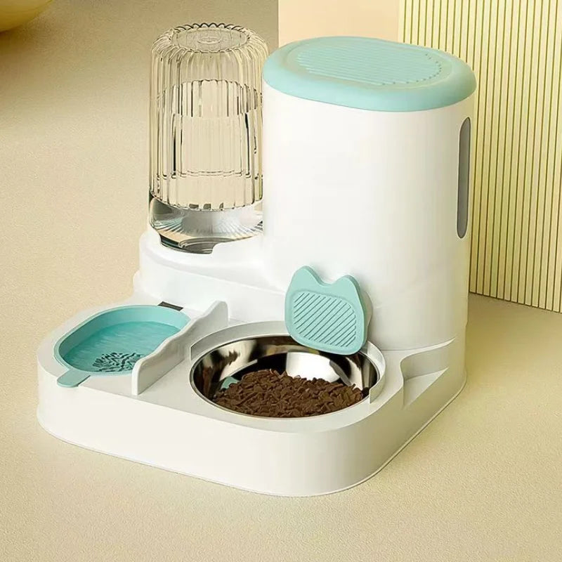 White and pastel blue automatic pet feeder with a water dispenser and stainless steel food bowl on a neutral surface.