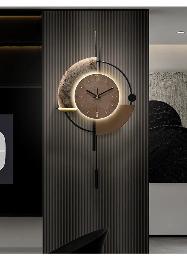 Modern minimalist brown wall clock with backlit circular face, abstract metal accents, and a sleek pendulum design.