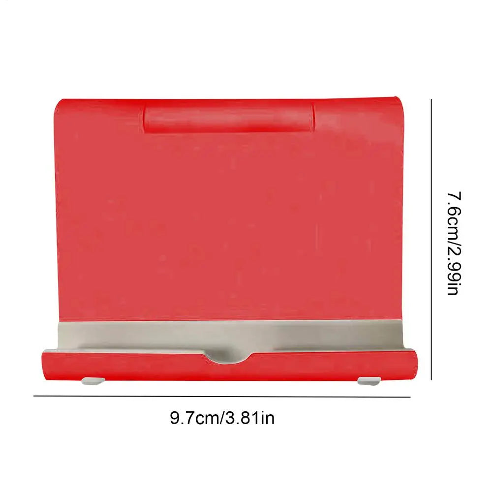 Red, foldable desk stand for phones or tablets, featuring a silver ledge and dimensions of 9.7cm by 7.6cm.