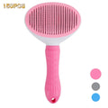 Pink and white pet slicker brush with a textured handle and fine metal bristles, isolated on a white background.