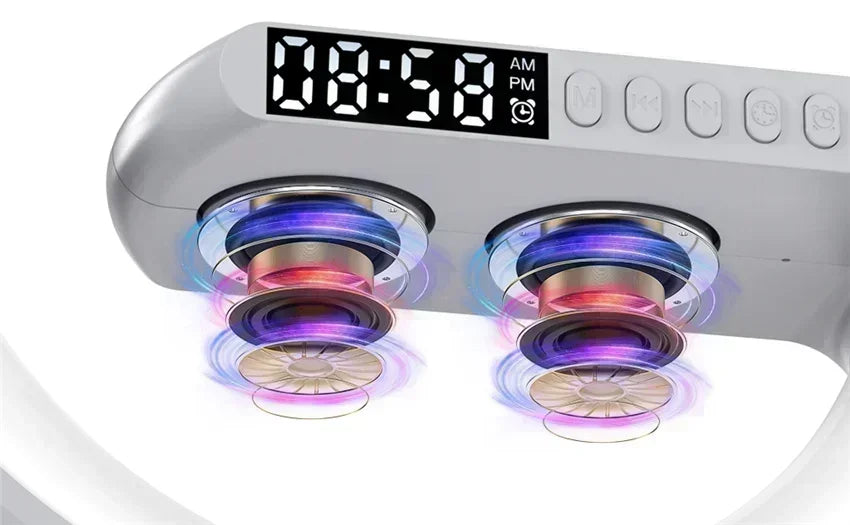 White wireless charging stand featuring a digital LED clock and dual speakers with vibrant, multi-coloured sound waves.