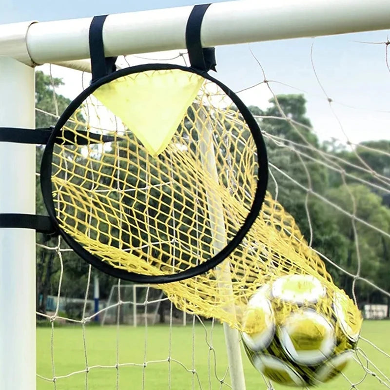 Yellow football target net attachment secured to a goal frame with a football inside the target area.