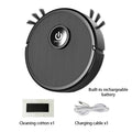A black robot vacuum with a central power button, side brushes, cleaning cotton, and a charging cable.
