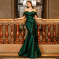 Dark green satin mermaid evening gown, off-the-shoulder neckline, sleeveless, with a side bow and ruffles.