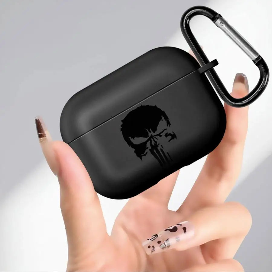 Matte black silicone AirPods Pro case featuring a Punisher skull design and a matching black carabiner clip.