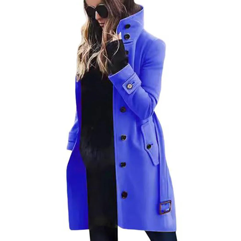 Woman wearing a vibrant blue wool-look mid-length coat with a high collar, button front, and cuff detailing.