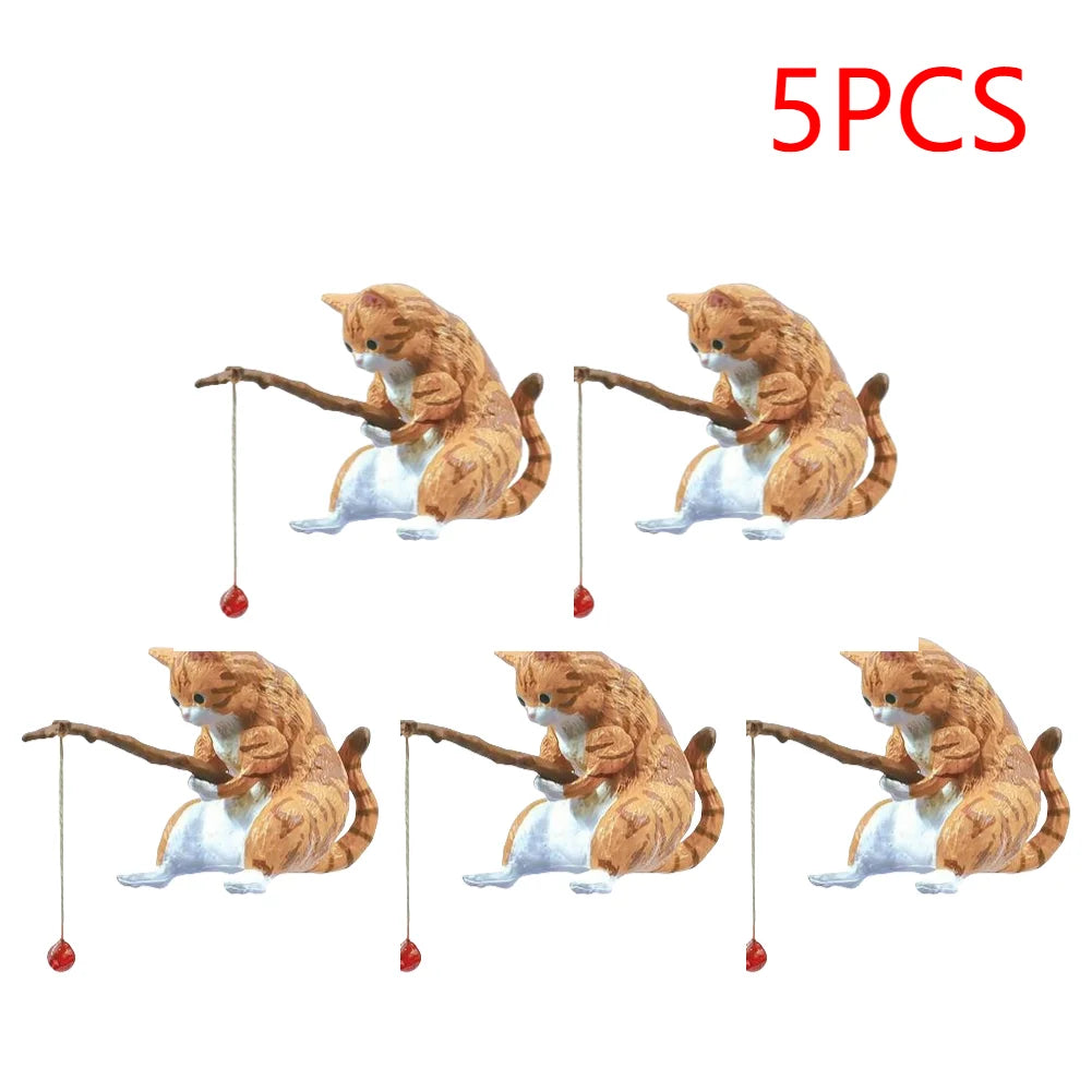 Set of five cute tabby cat aquarium ornaments, each painted orange and white and holding a tiny fishing rod with a lure.