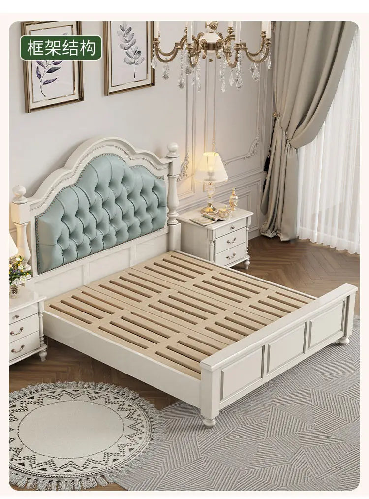 White double bed frame with a tufted sage green headboard and wooden slatted base in a classic, elegant bedroom setting.