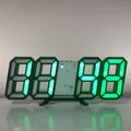 Modern black digital alarm clock with large, glowing green LED numbers, featuring PM, alarm and temperature indicators.