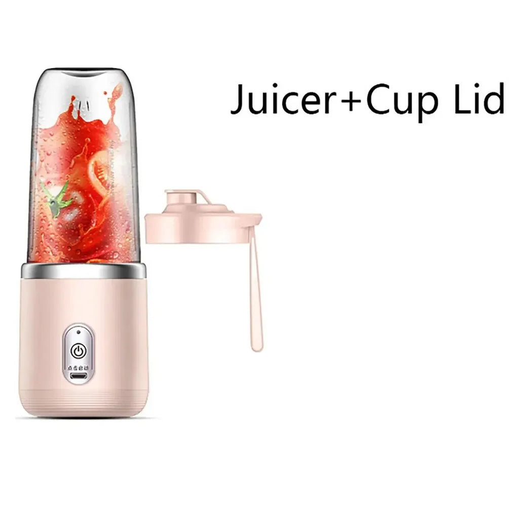 Portable pink personal blender with a clear cup containing tomato juice and a matching pink travel lid.