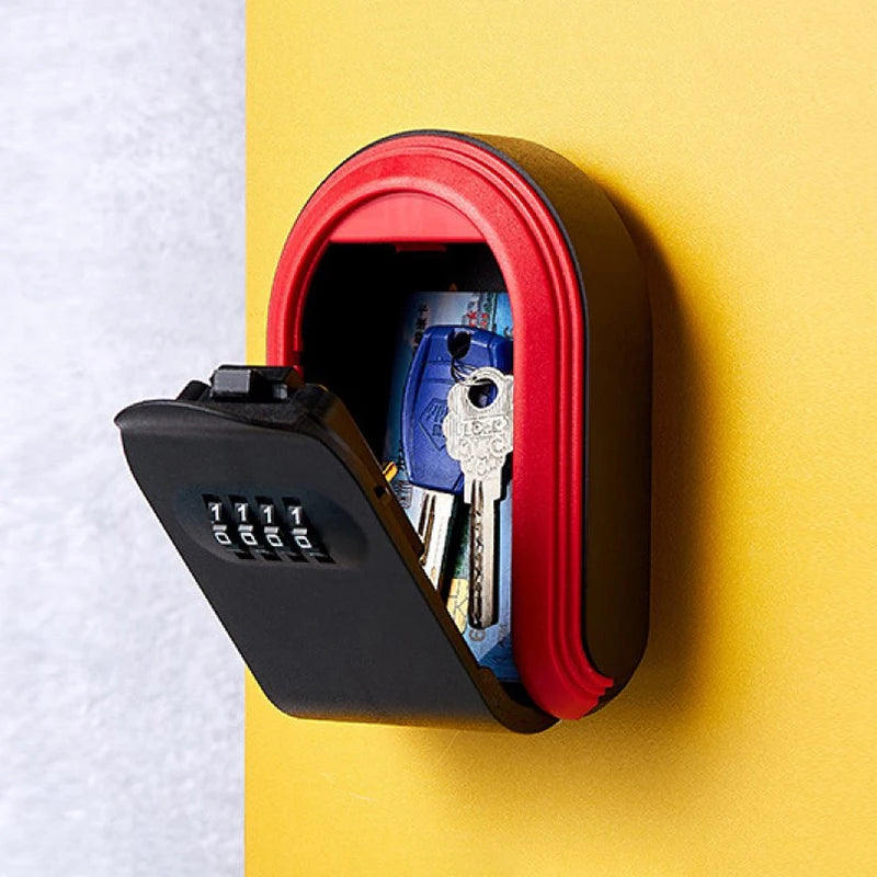 Black and red plastic wall-mounted key lock box with a four-digit combination code and keys inside.
