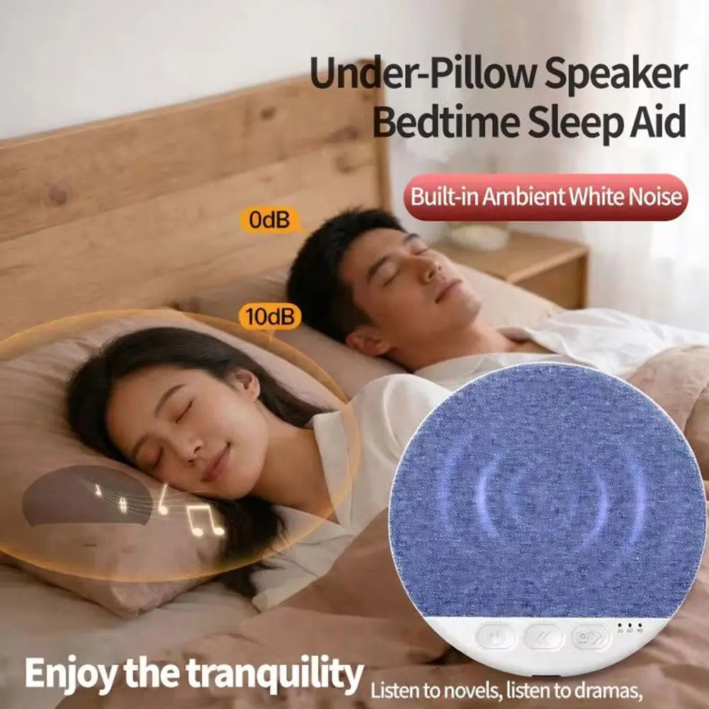 A circular, blue fabric-covered wireless under-pillow speaker for sleep, showing a couple resting peacefully in bed.