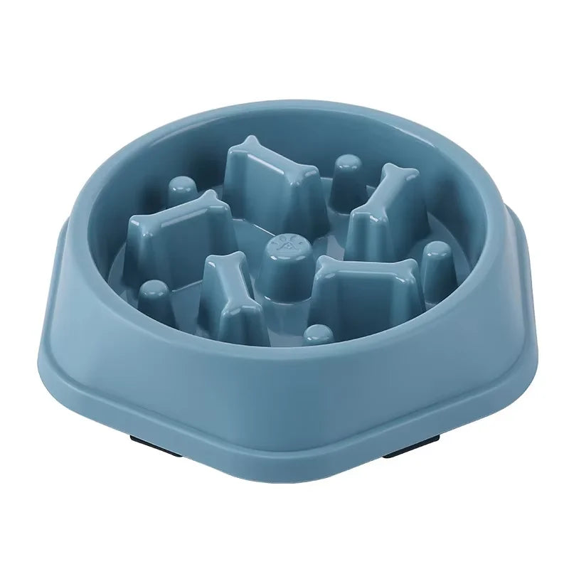 Blue, hexagonal slow-feeder pet bowl with bone-shaped interior obstacles for controlled eating.
