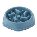 Blue, hexagonal slow-feeder pet bowl with bone-shaped interior obstacles for controlled eating.