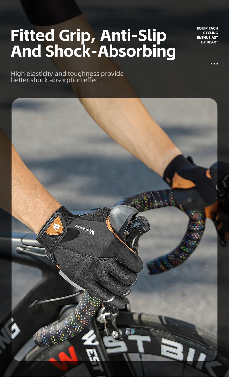 Close-up of hands wearing black and orange cycling gloves, gripping a bike handlebar with colourful tape.