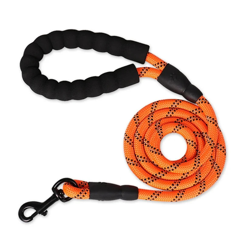 Orange reflective rope dog leash with a soft black padded handle and sturdy black metal clip.