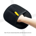 Black mesh wash mitt with a yellow hanging loop, worn on a hand against a white background.