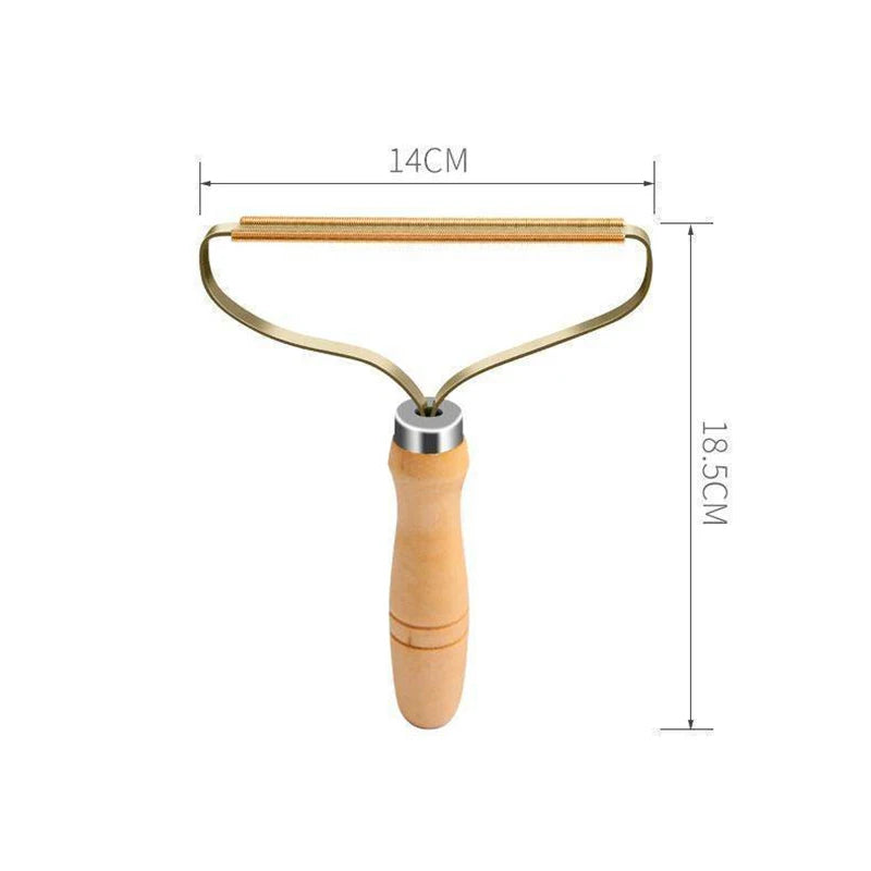 Gold-toned fabric lint remover with a wooden handle, showing dimensions of 14cm wide and 18.5cm long.