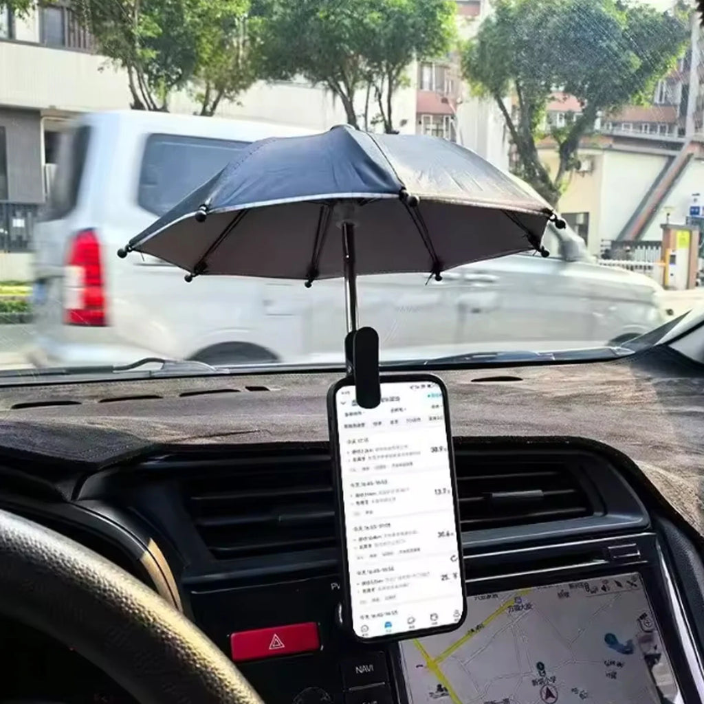 Black phone sunshade umbrella attached to a car dashboard mount, protecting the screen from glare.