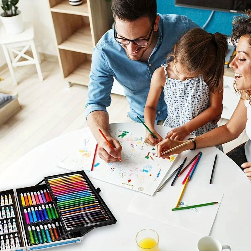 Family drawing together with a comprehensive art set featuring vibrant coloured pencils and paints in a carry case.