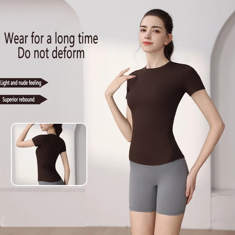 Model wearing a dark brown, short-sleeved, slim-fit performance t-shirt with a stretchy, lightweight texture.