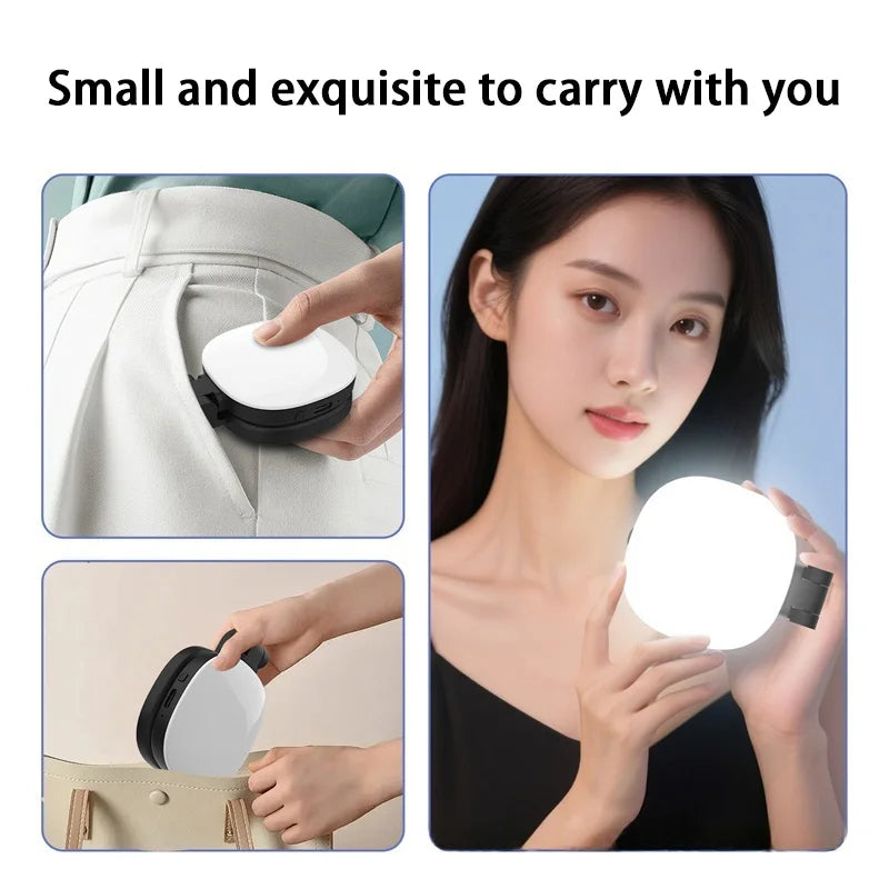 Compact, portable white and black LED selfie light with a foldable design, showing a woman using it for lighting.