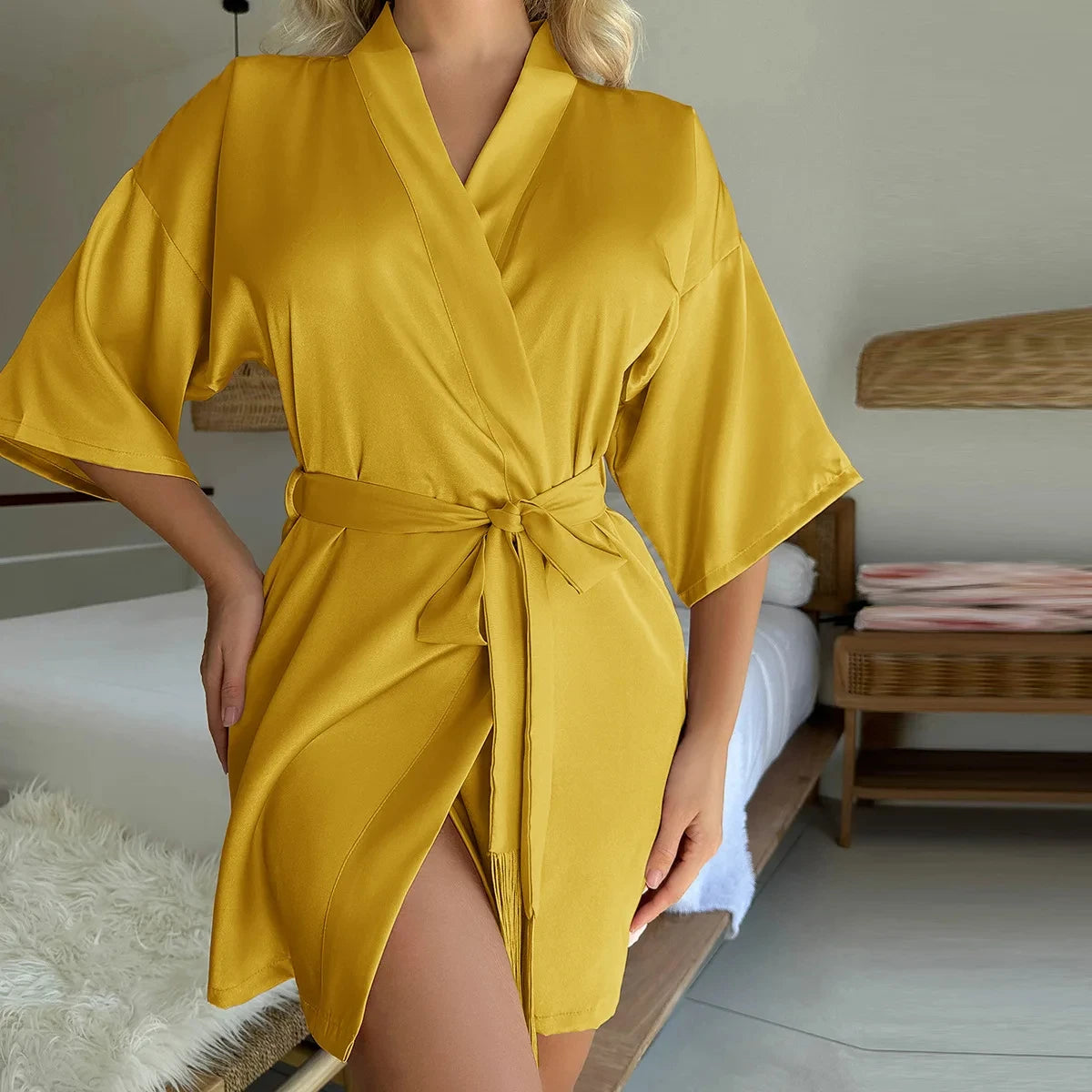 Mustard yellow satin short robe with wide sleeves, v-neckline, and a matching tie-waist belt.