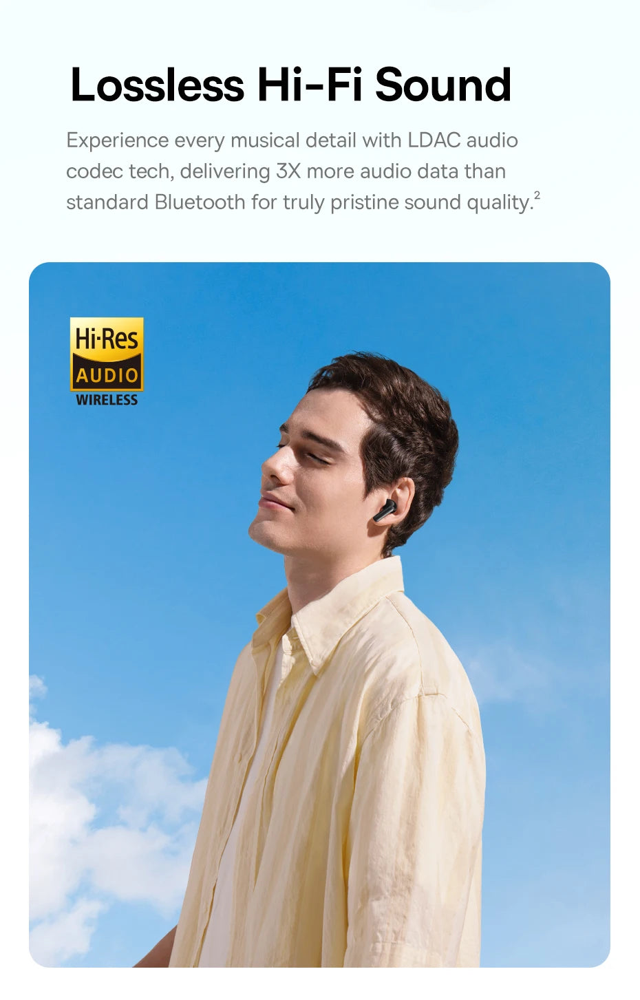 A man wearing sleek, black wireless earbuds outdoors against a bright blue sky. Hi-Res Audio Wireless logo visible.