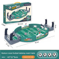 Tabletop football game with green pitch, two goals, manual controllers, and four mini balls. 42x21x9cm.