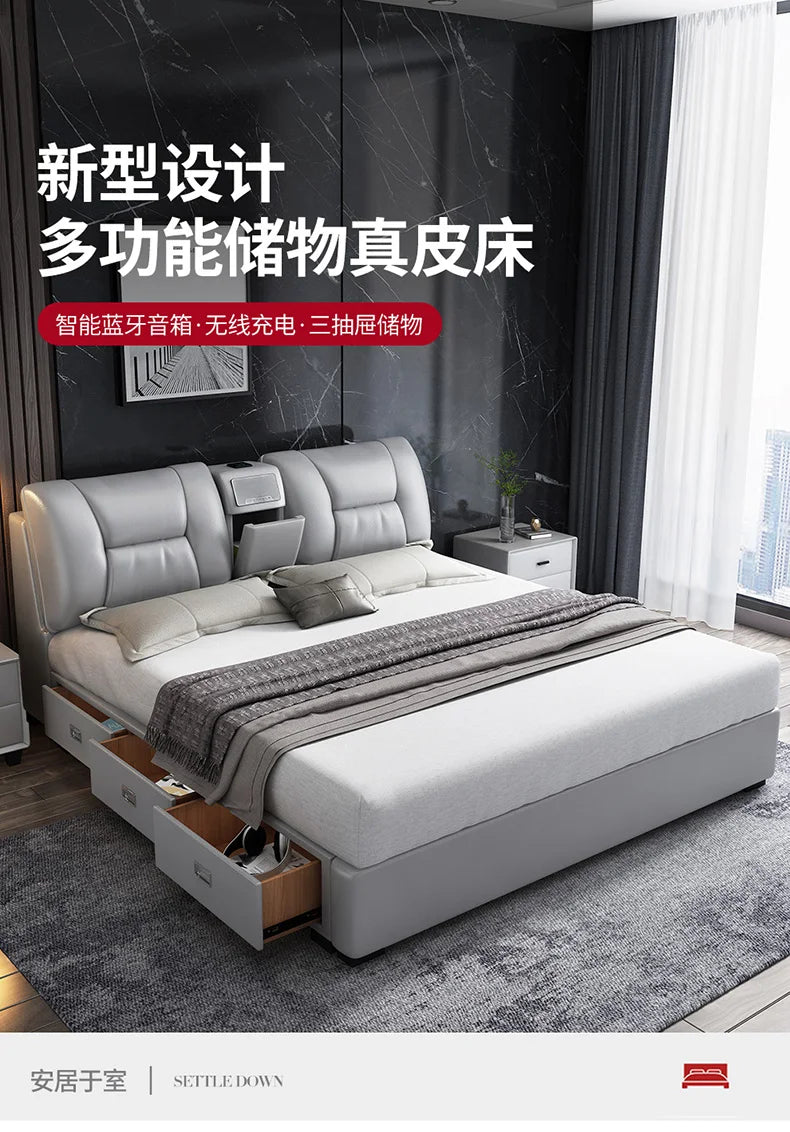 Minimalist grey upholstered king-size bed with built-in storage drawers, integrated wireless charger, and speakers.