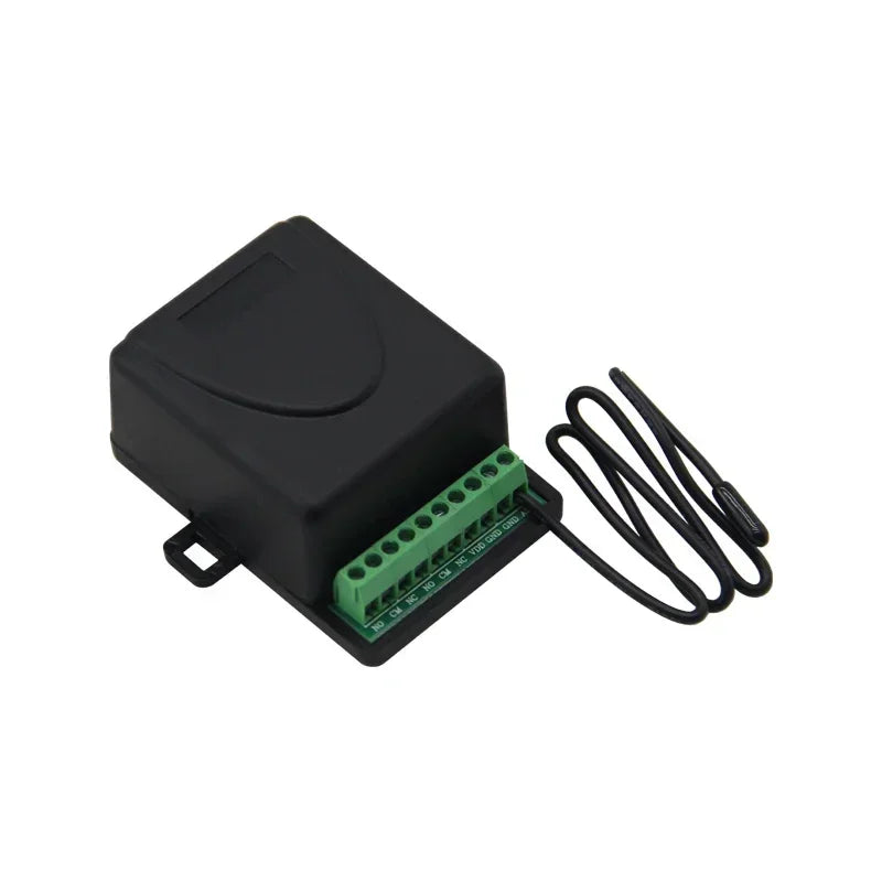 Black plastic temperature sensor module with a green terminal block and an external wired probe.