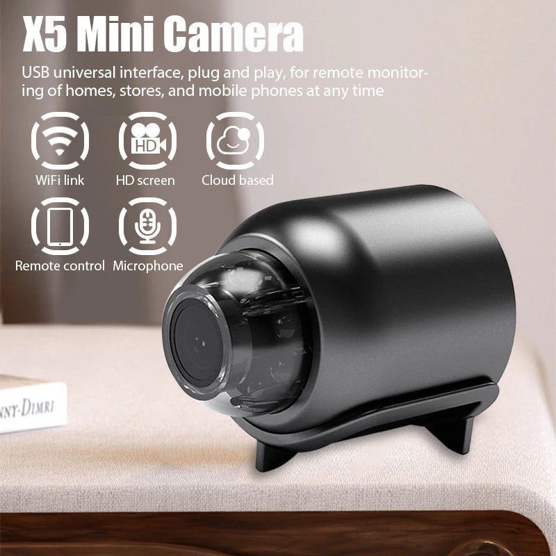 Black plastic X5 mini security camera with a spherical lens and built-in stand, featuring WiFi and a microphone.