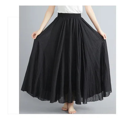 A flowing, black, high-waisted maxi skirt with an elasticated waistband and a full, flared silhouette.