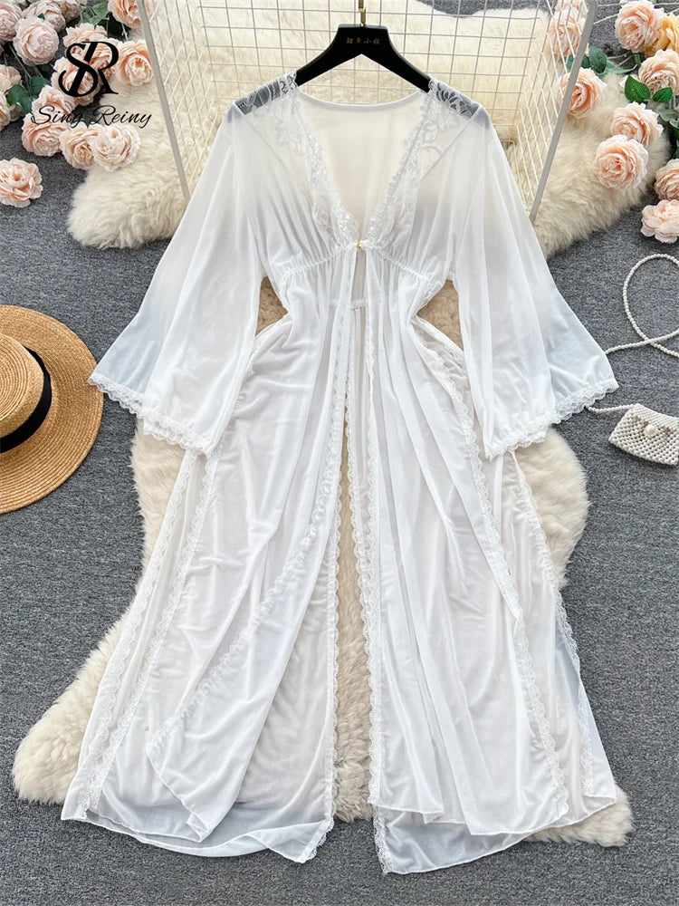 White sheer mesh long sleeve robe with lace trim, V-neck, and front split, displayed on a hanger.