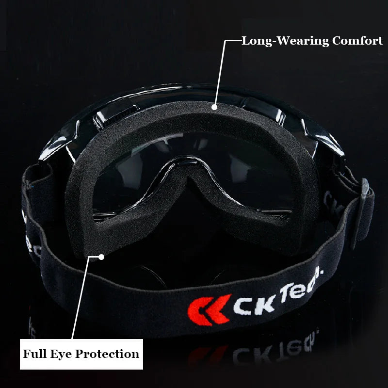 Black safety goggles with thick foam padding, clear anti-impact lenses, and an adjustable elastic strap.