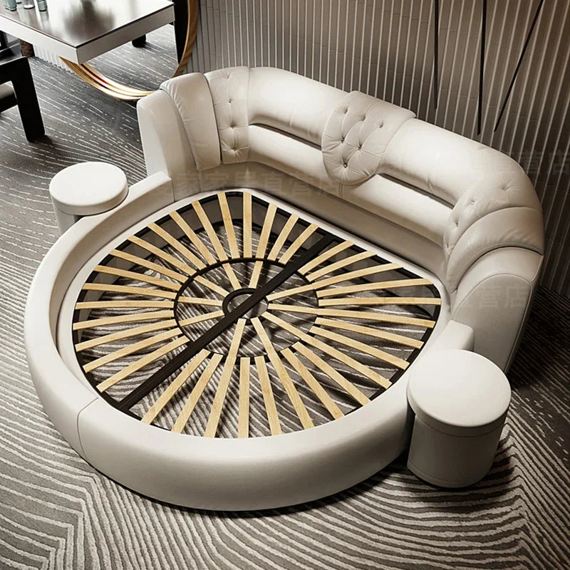 Modern round white faux leather bed frame with button-tufted backrest, wooden slats, and integrated side stools.