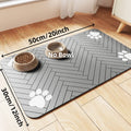 Grey rectangular pet feeding mat with a herringbone pattern and white paw prints. Dimensions 50x30cm. No bowls included.