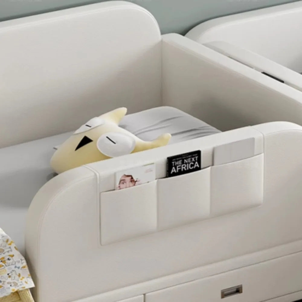 Modern off-white upholstered bed with a built-in side storage pocket for books and essentials.