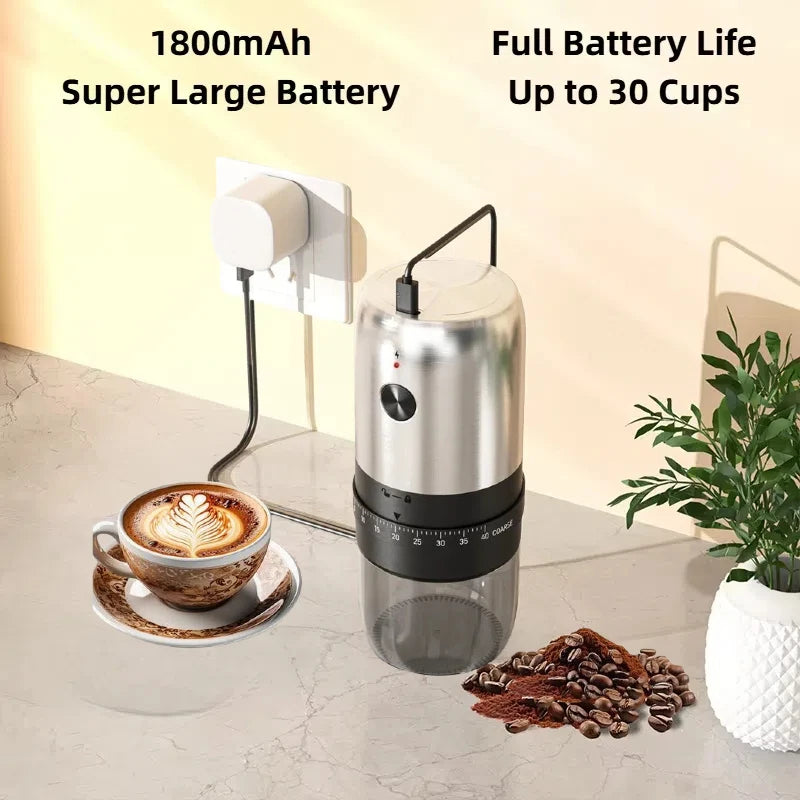 Silver and black portable electric coffee grinder with adjustable settings, shown charging on a marble countertop.