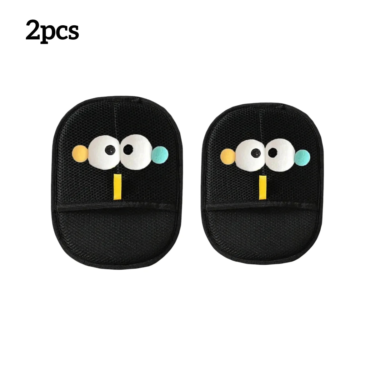 Two black mesh face washing wristbands featuring playful cartoon faces with white eyes and yellow details.