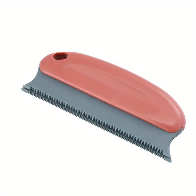 Dusty pink and grey pet hair remover tool with a serrated rubber edge and a hanging hole.