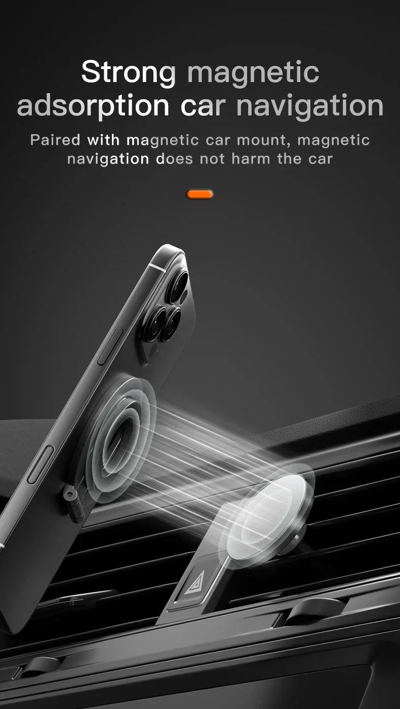 A sleek, silver magnetic car mount attached to a black car air vent, holding a smartphone with magnetic alignment.