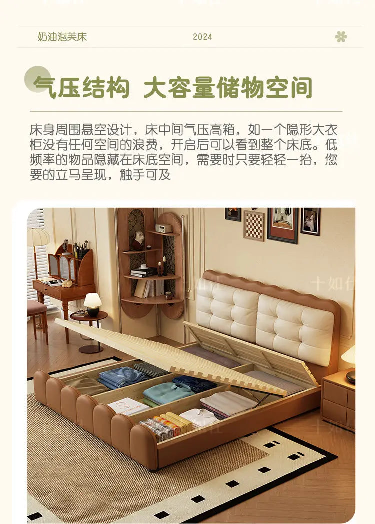 Modern cream and brown upholstered platform bed with a gas-lift mechanism revealing spacious under-bed storage.
