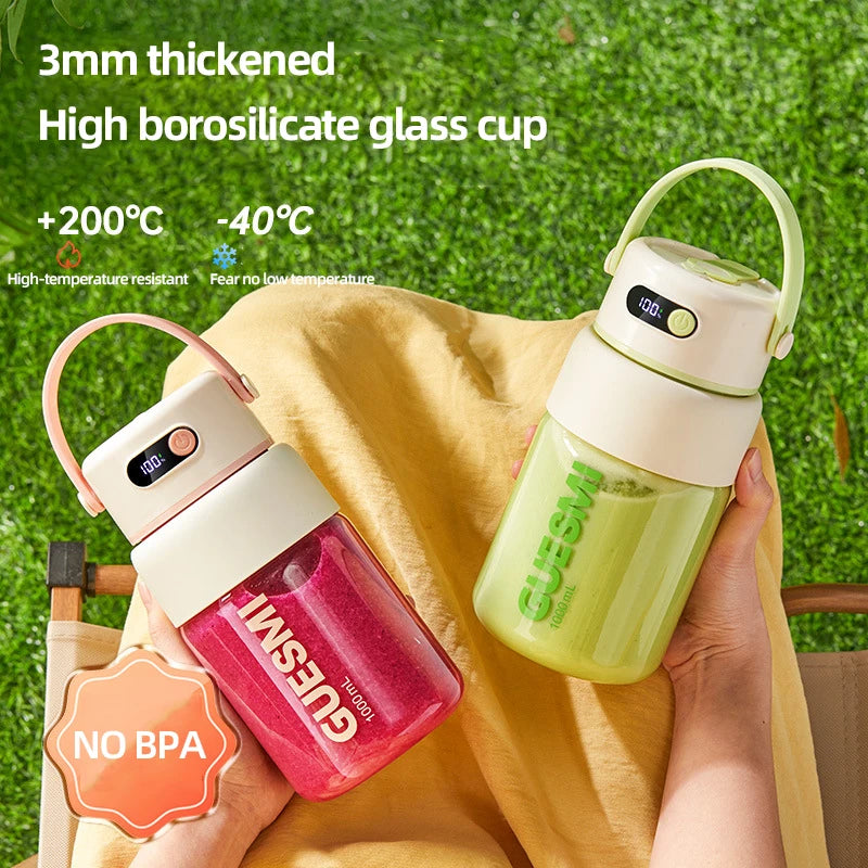 Two portable 1000ml glass cups with carrying handles, digital temperature displays, and cream-colored lids.