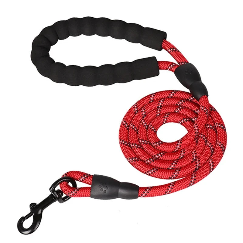 Red reflective rope dog leash with a black padded foam handle and a heavy-duty black metal clasp.