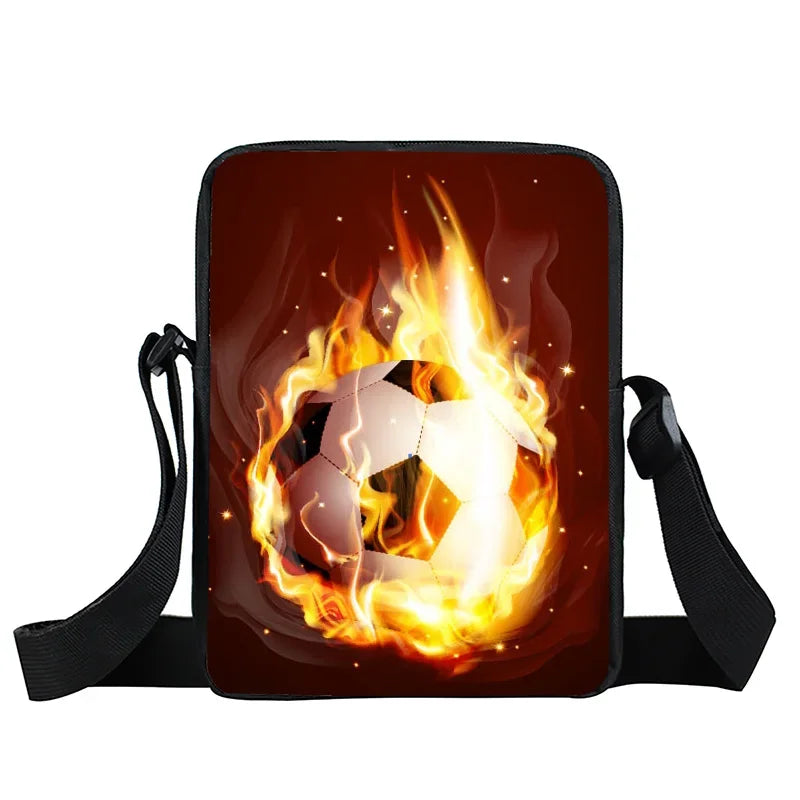 Black crossbody bag featuring a printed graphic of a soccer ball surrounded by vibrant orange flames.